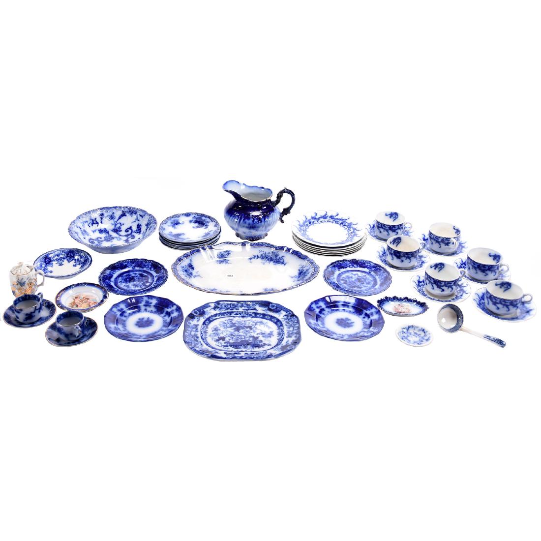 Assortment of Flow Blue Items: Large Assortment of Flow Blue Items, Assortment Includes; (18) Pieces of Venice Pattern; (6) Bellmont Pattern Plates; (2) Cuba Pattern Plates; (1) Touraine Pattern Platter, 15"; (1) Advertising Ash Tr