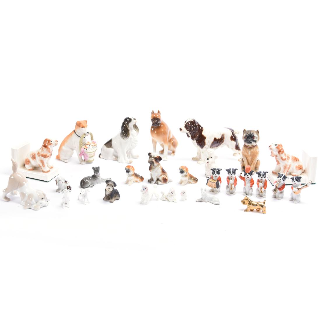 (28) Assorted Dog Figurines: Large Assortment of; (28) Dog Figurines, Royal Dux Boxer, Six Piece Dog Band, made in Japan, Spaniel Made in Ussr, Goebel Spaniel, and More, See Photos for Details