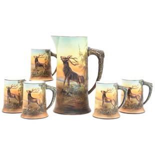 Six Piece Blown Mold Tankard Set Marked Nippon: Six Piece Marked Nippon Blown Mold Tankard Set Marked Nippon, Blown Mold Stag with Figural Stag Horn Handle, 11" Tankard and; (5) Matching 4.75" Mugs, One Mug Has Hairline
