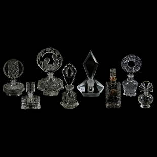 (8) Clear Art Glass Perfume Bottles: (8) Clear Art Glass Perfume Bottles Including (1) 8" Unmarked Czechoslovakia, Round Stopper with Courting Scene; (1) 7.5" Diamond Shaped, Unmarked, Others Range Down to 4" Probably Czechoslovakia