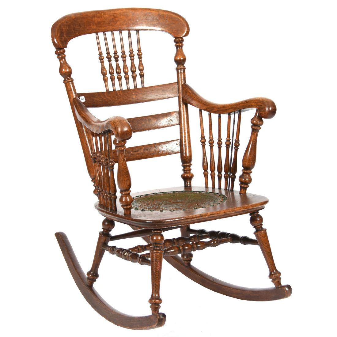 Oak Rocking Chair, Embossed Zodiac Symbol Seat: Oak Rocking Chair with Embossed Zodiac Symbol Seat, 37" X 23" Two Back Spindles with Repair (one of these spindles is currently off and in two parts)