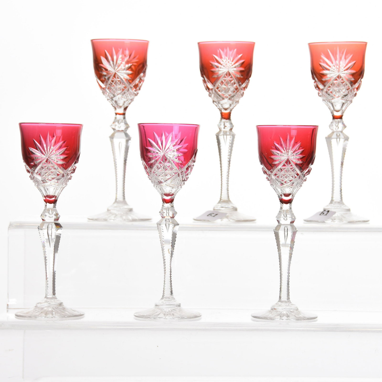 (6) Cordial Stems, Val St. Lambert: (6) Cordial Stems by Val St. Lambert, BPCG, 5.5" Unknown Pattern Features Hobstar, Strawberry Diamond & Fan Motif, Double Teardrop Stem, Ray Cut Foot; (3) Amber; (3) Cranberry; Slight Variations in Co