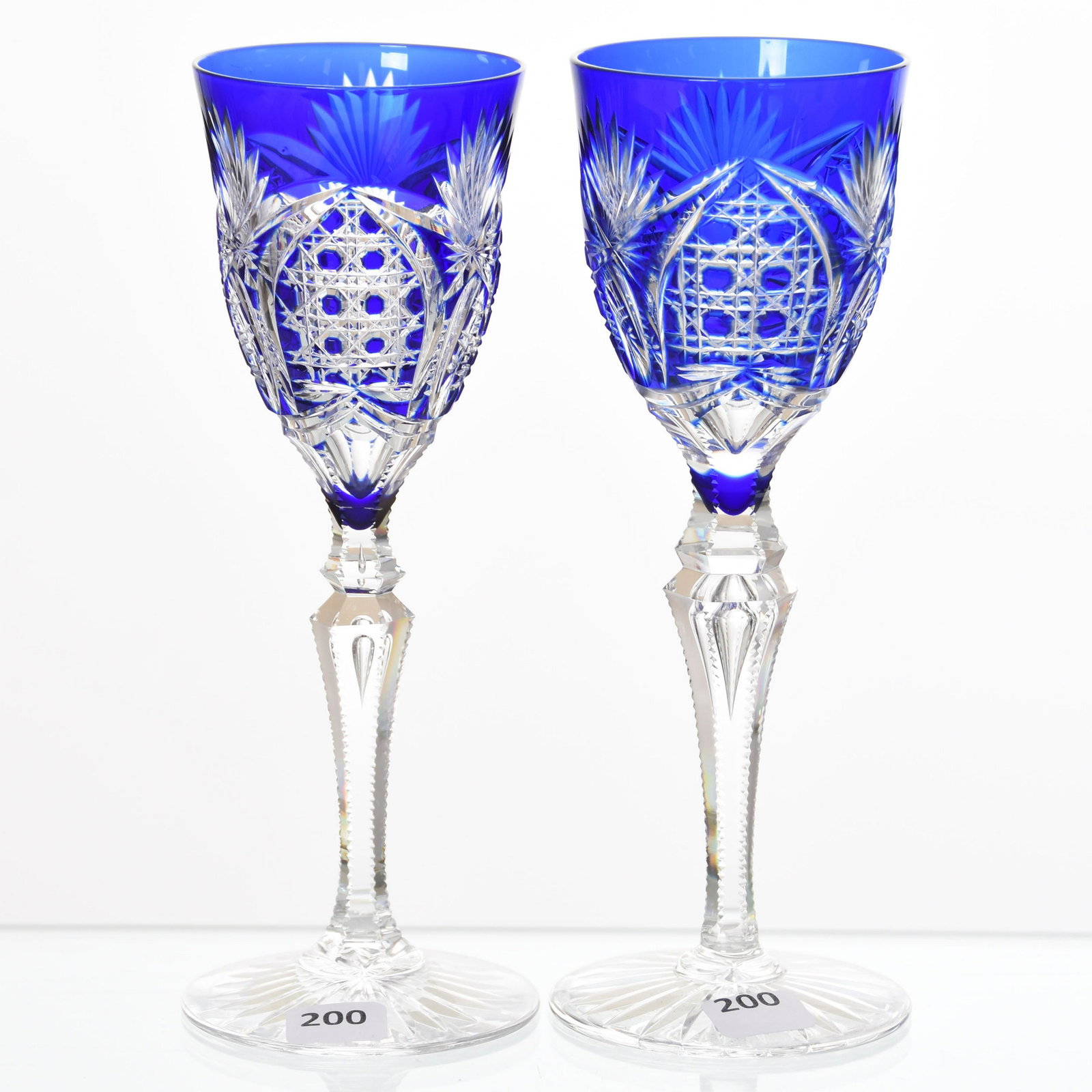 (2) Wine Stems, Val St. Lambert: (2) Wine Stems by Val St. Lambert, BPCG, 8.5" Cobalt Blue Cut to Clear, Richepin Pattern, circa 1920, Tear Drop Stem, Ray Cut Foot; Variations Between the Two Stems