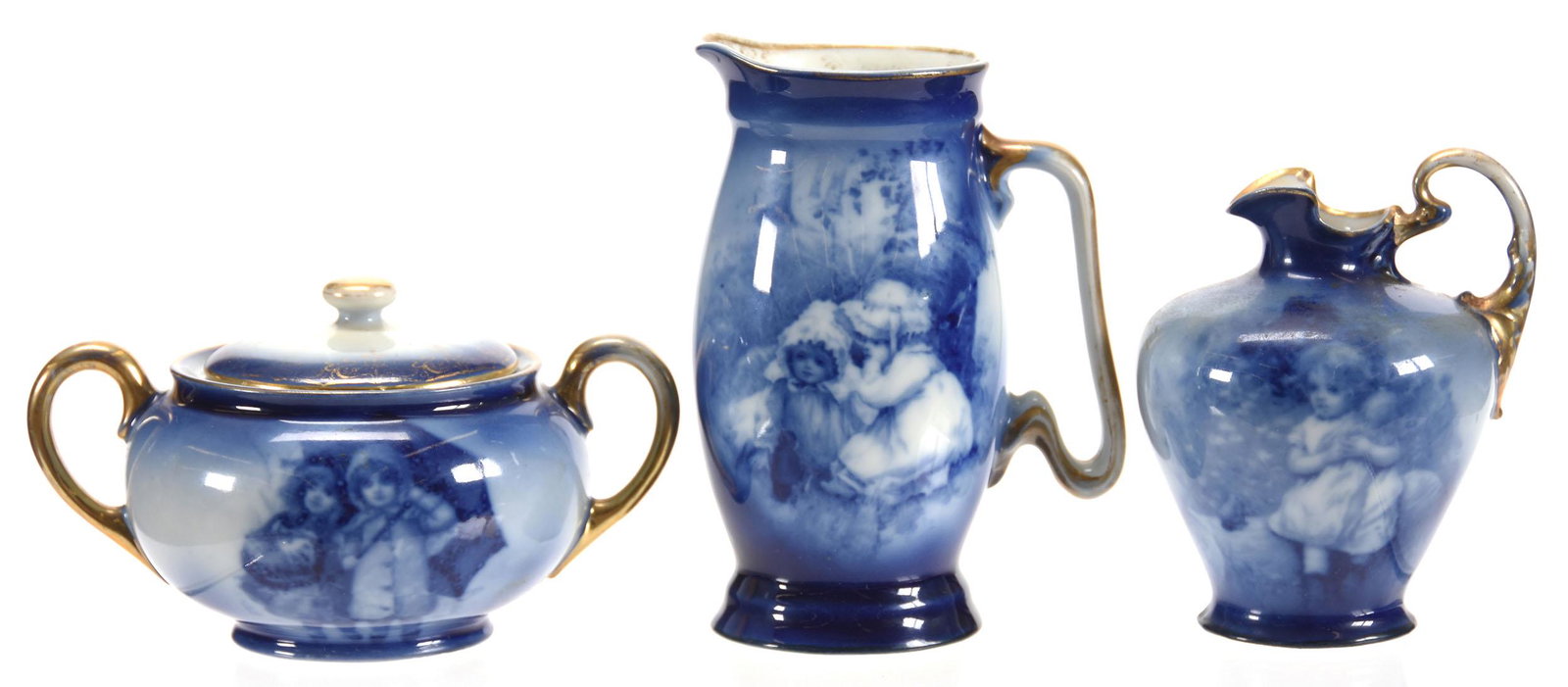 (3) Items, Marked Royal Bayreuth, Babes in Woods: (3) Items, Marked Royal Bayreuth, Babes in Woods; (1) 5.25" Creamer, Two Girls Talking to Small Witch; (1) 4.25" Creamer, Girl Sitting Holding Doll on Log; (1) Covered Sugar, Two Girls Under Umbrella;