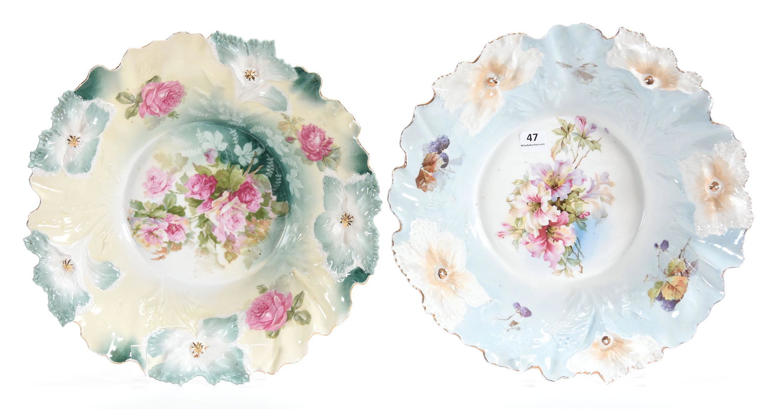 (2) Bowls, Carnation Mold, Floral Scenes: (2) Bowls, Carnation mold; 11.75" (1) Lily scene; blue & white, berry highlights; (1) marked R.S. Prussia, Pink Rose scene; green & yellow tones; Terry Eichler Estate, Wisconsin