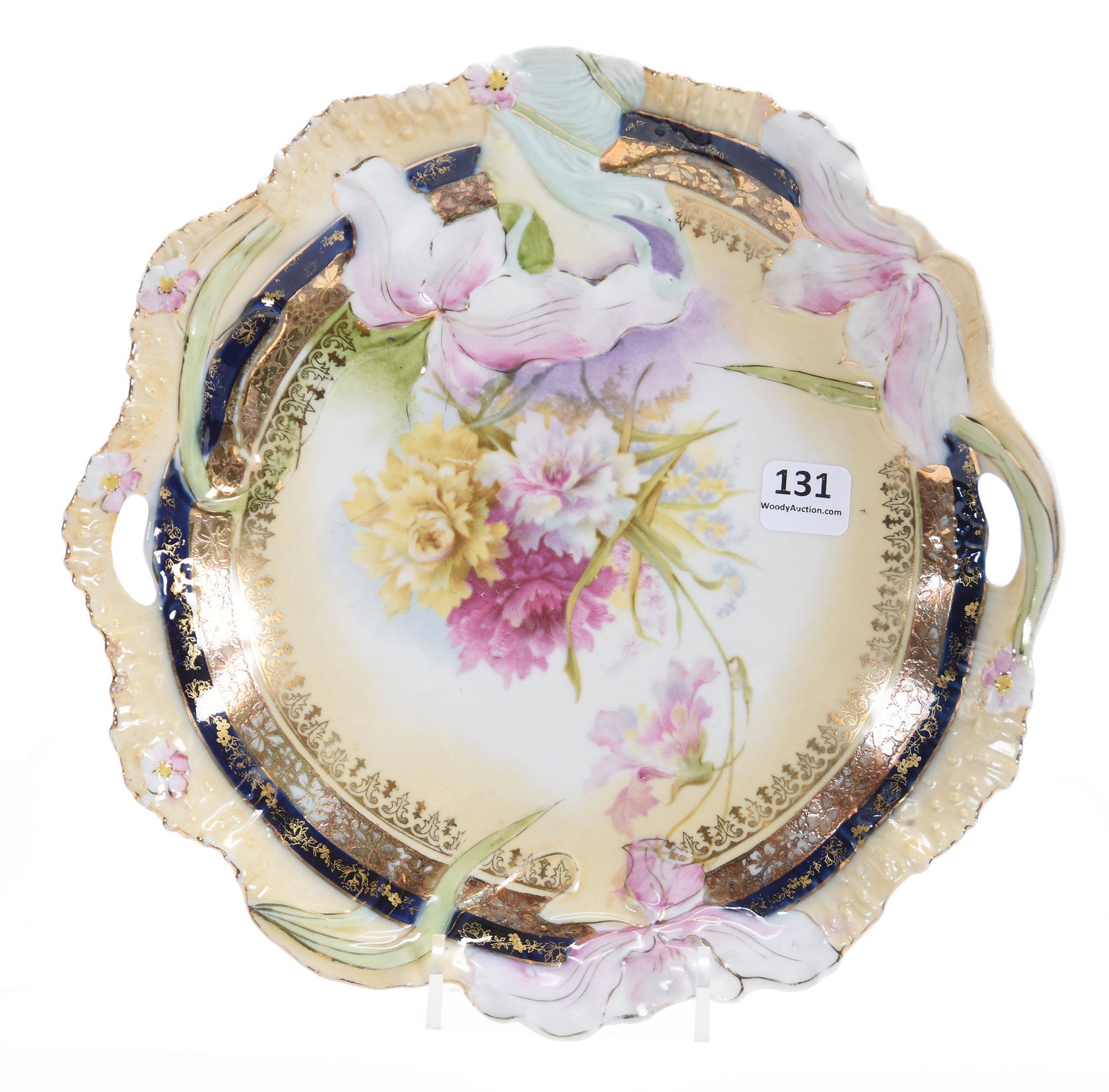Cake Plate, Unmarked Prussia, Hidden Image Mold: Cake Plate, unmarked Prussia, Hidden Image mold; 9.5", Floral scene, cream tones with cobalt blue & gold trim; Libbie Krug Collection, Iowa