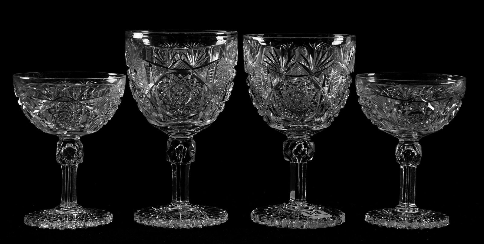 (4) Stems, Acme Pattern by J. Hoare: (4) Stems, Acme Pattern by J. Hoare, ABCG; (2) 6.25" Water Goblets, (2) 4.25" signed J. Hoare champagnes; all with scalloped hobstar foot; slight height variations; Sam & Becky Story Estate, Missouri