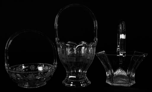 (3) marked Heisey clear glass baskets: (3) marked Heisey clear glass baskets 13", 10.5", 9" (1) 13" x 6.5" Colonial with floral design; (1) 10.5" x 8.25" Six sided, mitre base; (1) 9" x 7.25" Round with engraved floral design; Nancy