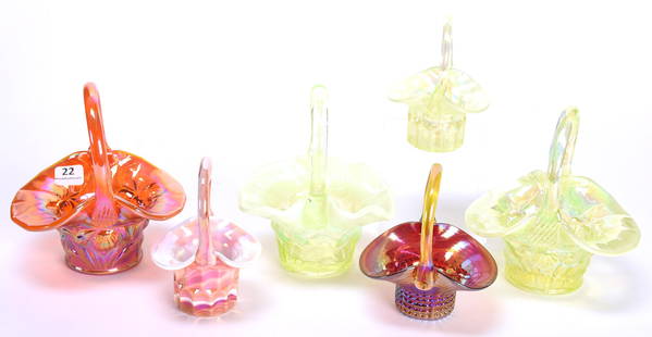 (6) marked Gibson iridescent Art Glass Baskets: (6) marked Gibson iridescent Art Glass Baskets range from 4" - 6" (2) 6" Vaseline Iris mold; (1) 6" Orange Iris mold; (1) 4" Red; (1) 4" Vaseline; (1) 4" Pink & white slag; Nancy Rublaitus Estate