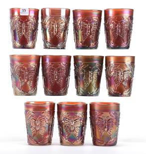 (11) Carnival Tumblers, Butterfly & Fern Pattern: (11) Carnival tumblers, Butterfly & Fern pattern; 4" (10) Amethyst; (1) Green - Fenton; Bill Maxton Collection, Illinois. UPDATED 12-5-19: One Tumbler has crack on base and air bubble.