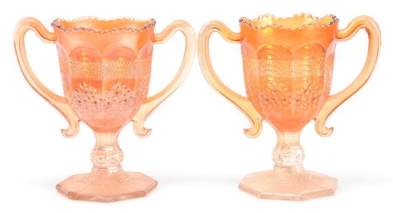 (2) Carnival Glass Two Handled Loving Cups, Marigold: (2) Carnival glass two handled loving cups, Marigold; 5.75" Orange Tree pattern by Fenton - one cup with base chip; Bill Maxton Collection, Illinois