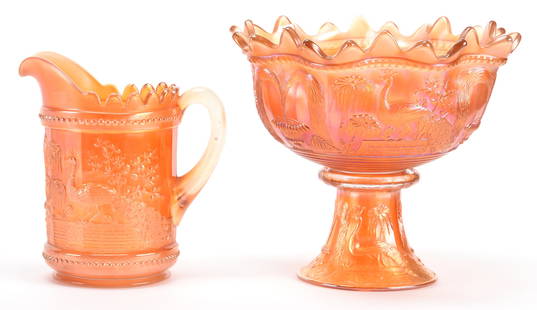 (2) Carnival Glass Peacock at Fountain Pattern Items: (2) Carnival glass Peacock at Fountain pattern items; 10" x 11", 8.5" Marigold - (1) 10" x 11" Two-part punch bowl (bowl with serious crack); (1) 8.5" Water pitcher, cracked; Bill Maxton Collection,