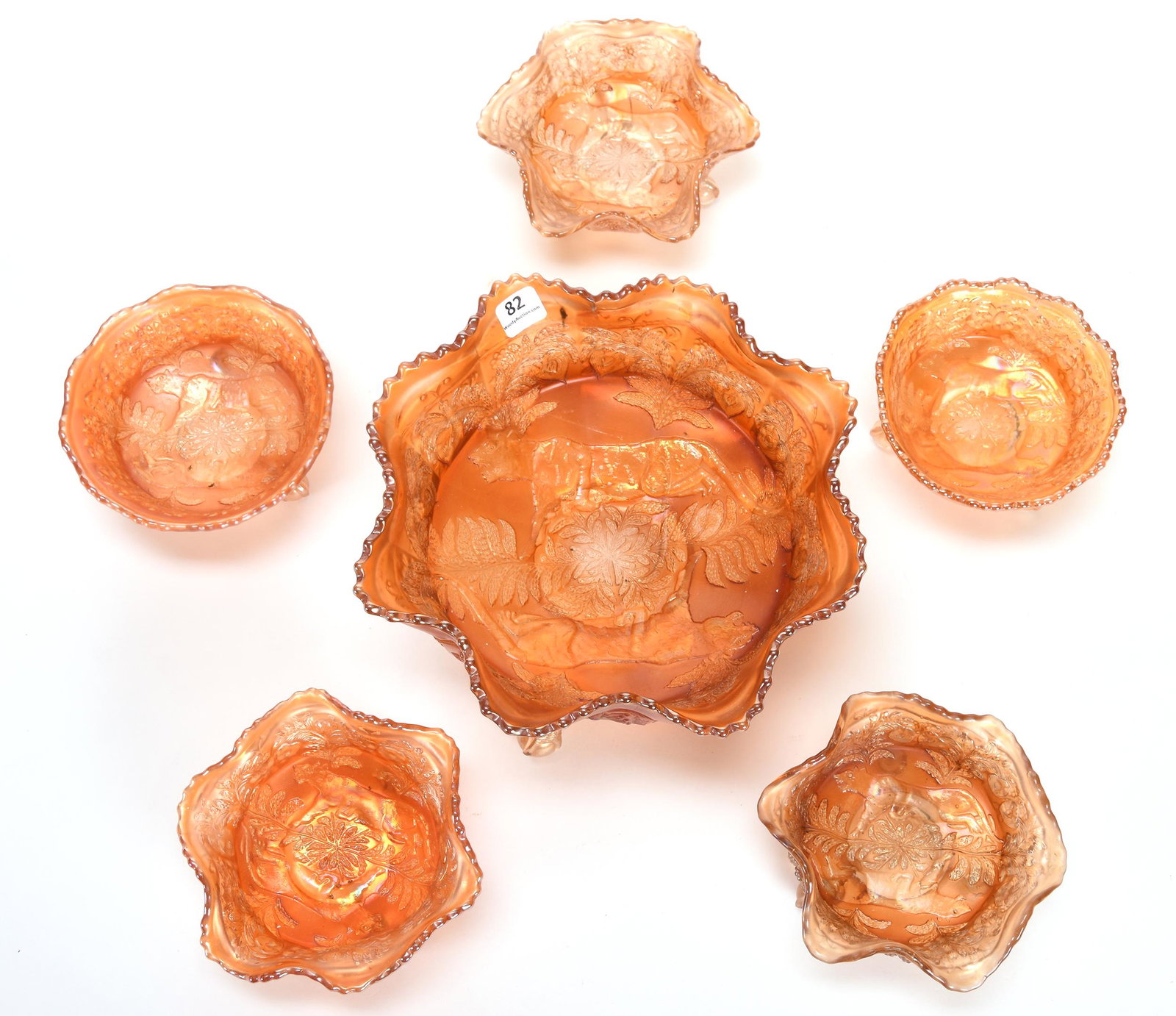 Carnival Glass Berry Set, Panther Pattern by Fenton: Carnival glass berry set, Panther pattern by Fenton; 9", 5" Marigold - includes: (1) 9" Master, ruffled; (3) 5" Berry bowls, ruffled (one has open bubble on base, one cracked); (2) 5" Berry bowls, rou