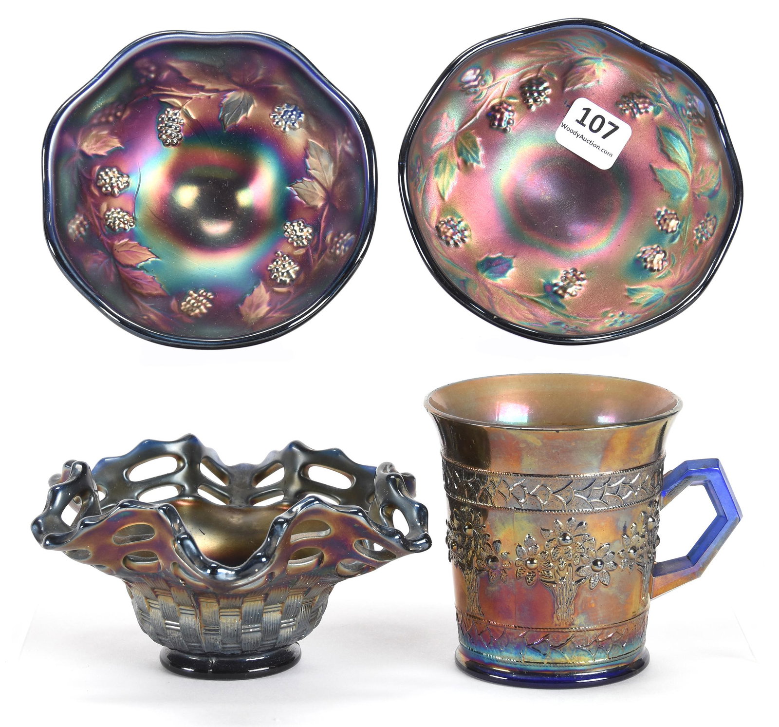 (4) Carnival Glass Items, All Blue by Fenton: (4) Carnival glass items, all Blue by Fenton; various sizes; Includes: (2) 2.5" x 4.5" Raspberry pattern compotes, both with small chips on foot; (1) 5.5" Two Row Open Edge basket; (1) 3.5" Orange Tre