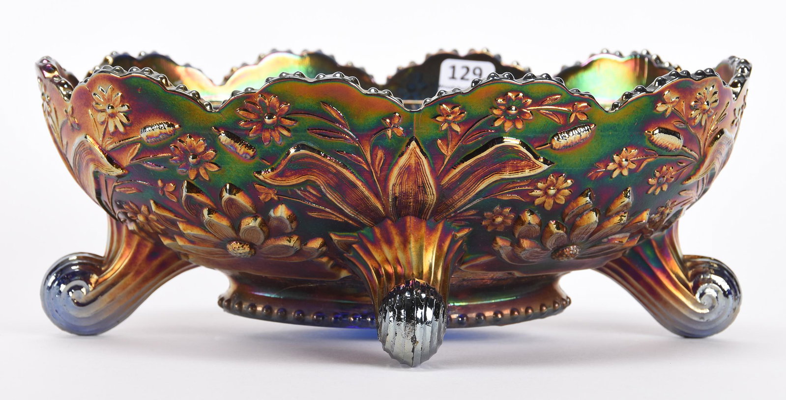 Carnival Glass Footed Banana Bowl, Thistle Pattern: Carnival glass footed banana bowl, Thistle pattern; 4" x 10.5" Blue by Fenton, water lily and cattail exterior - nice color; Don Anderson Collection, Kansas