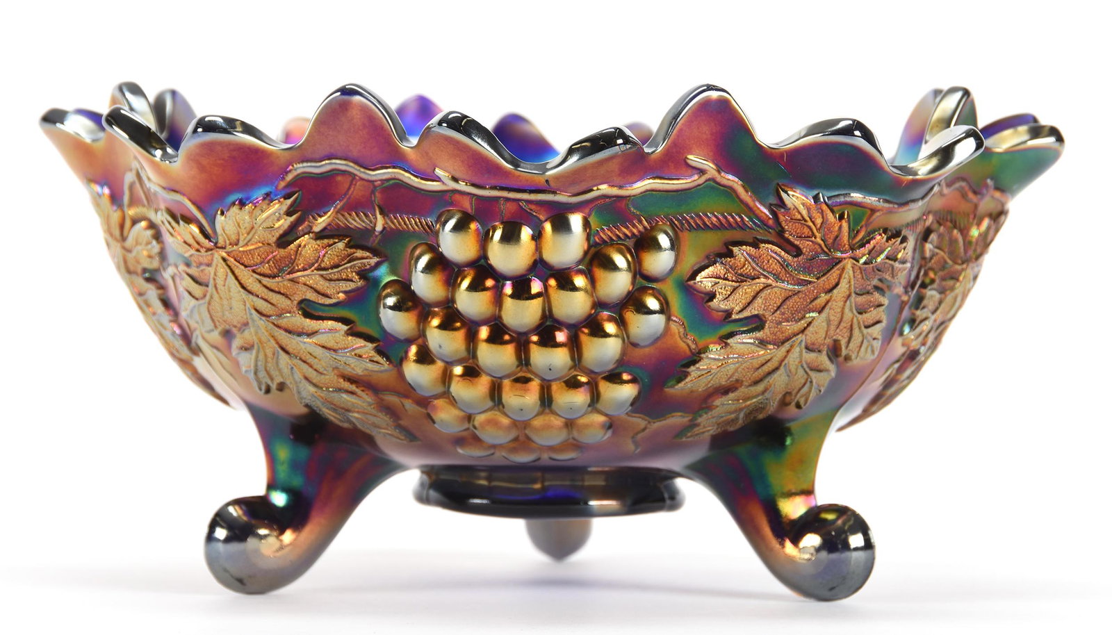 Carnival Glass Three Footed Orange Bowl by Northwood: Carnival glass three footed orange bowl by Northwood; 5.25" x 10.75" Grape & Cable pattern, Blue - Nice iridescence; Don Anderson Collection, Kansas