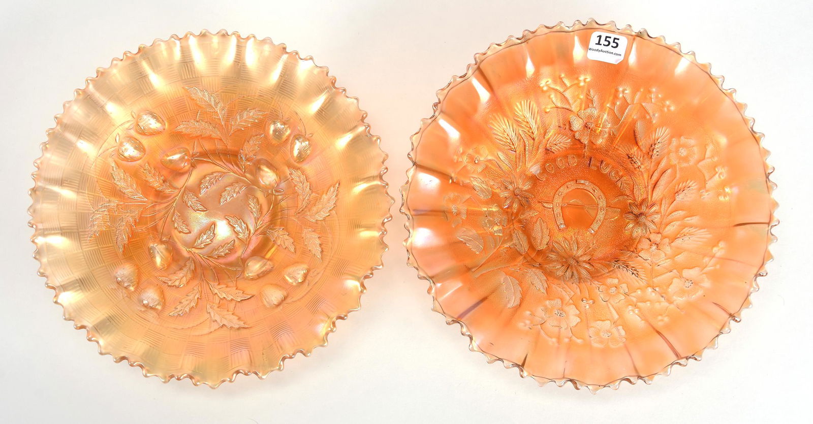 (2) Carnival Glass Bowls, Marigold by Northwood: (2) Carnival glass bowls, Marigold by Northwood; 8.75", 8.5" (1) 8.75" Good Luck, ribbed exterior, sm chip on horseshoe; (1) 8.5" Strawberry pattern, basket weave exterior - both with pie crust edge;