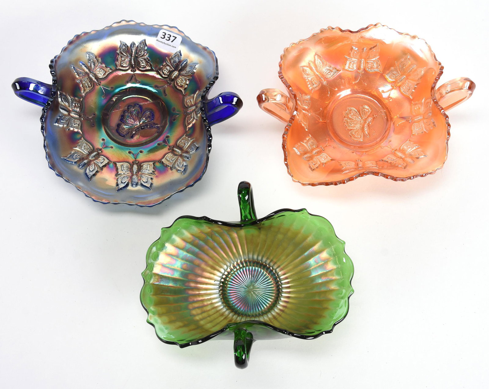 (3) Carnival Glass Two Handled Bonbons by Fenton: (3) Carnival glass two handled bonbons by Fenton; 7" (1) Butterflies pattern, blue; (1) Butterflies pattern, marigold; (1) Smooth Rays pattern, Green; Don Anderson Collection, Kansas