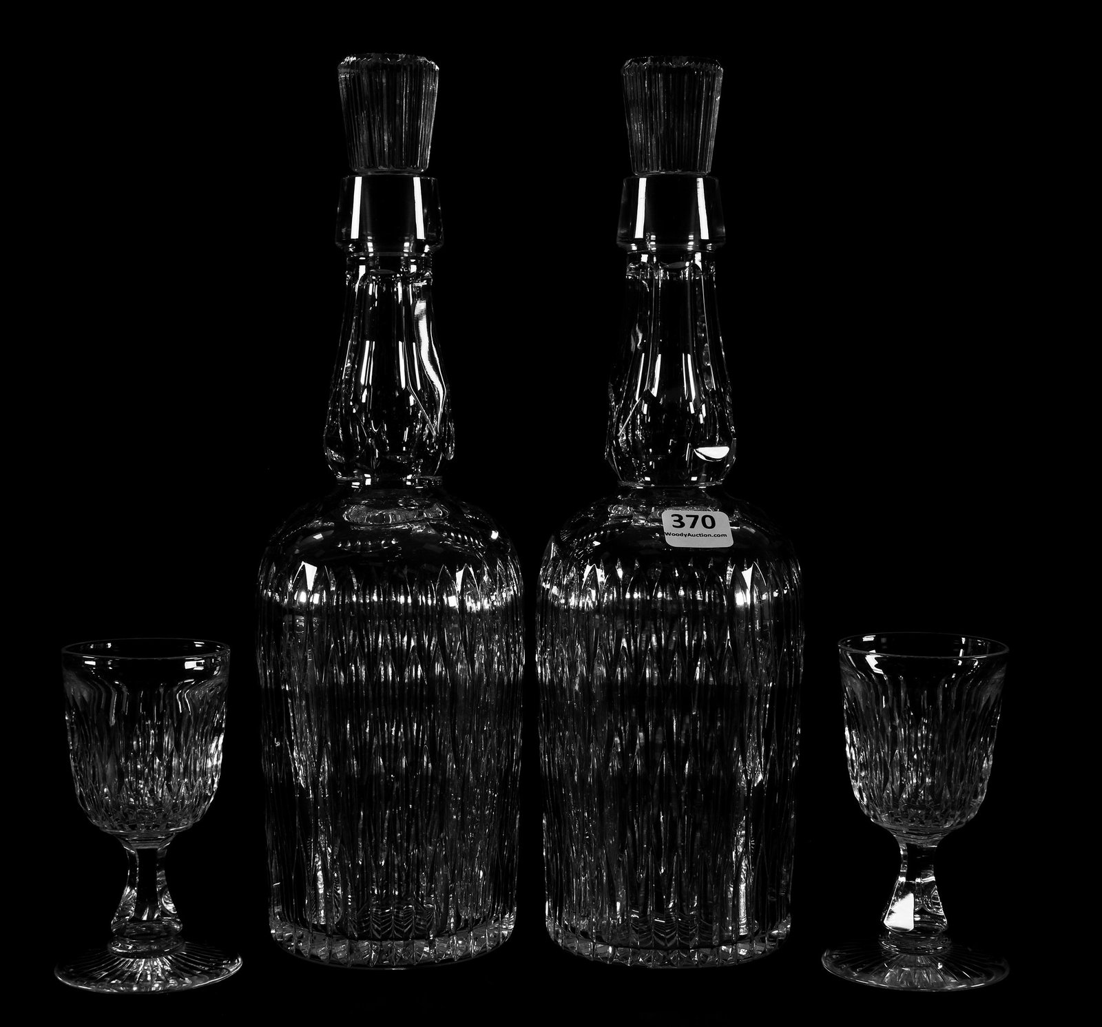 Pair Whiskey Decanters and Wine Glasses, ABCG: Pair Whiskey Decanters and Wine Glasses, ABCG, 11.75" 4.25" (2) 11.75" Whiskey Decanters with Vertical Mitre & Punty Motif with (2) 4.25" Wine Glasses - Attributed to Pairpoint - Extra Clear Blanks; E