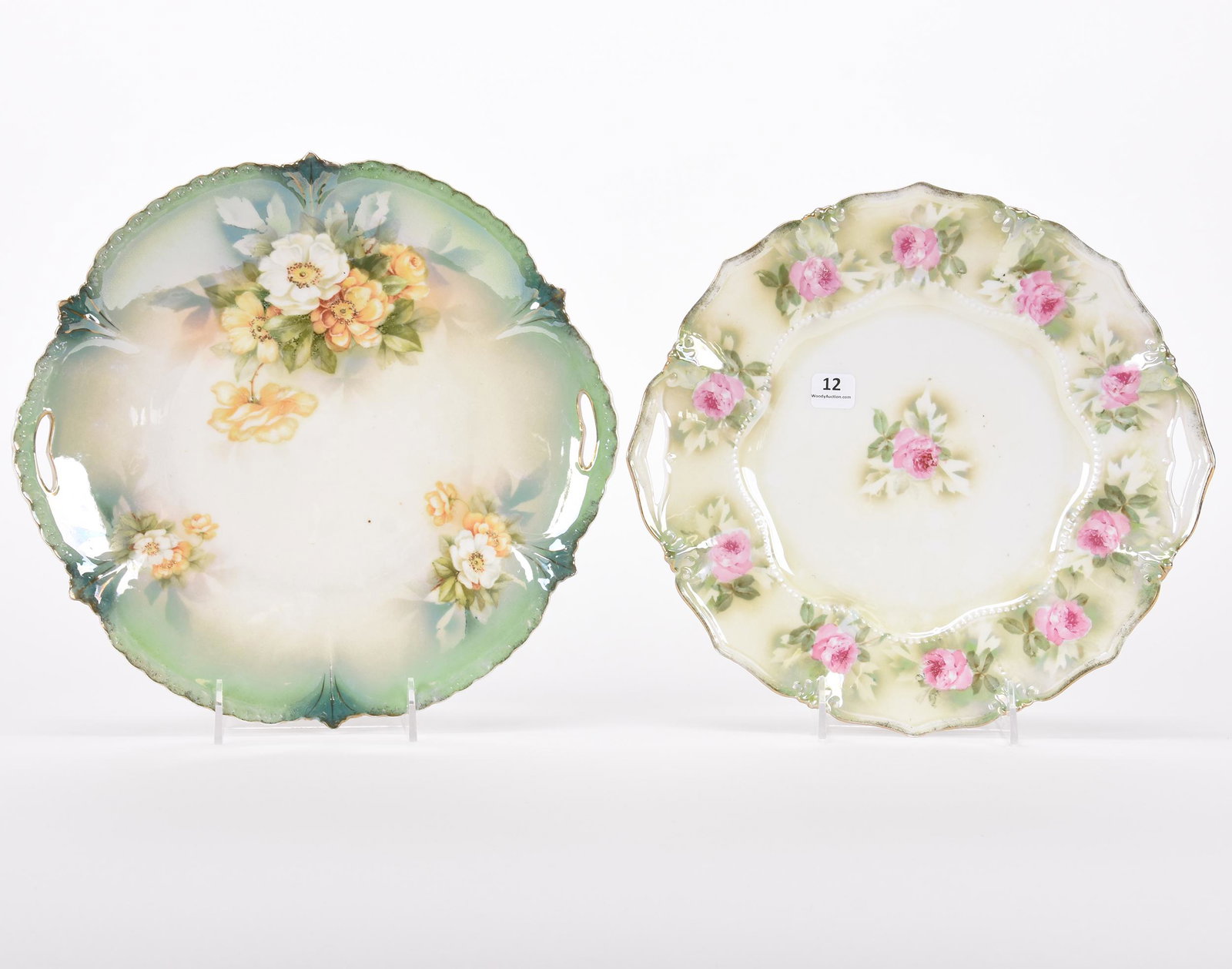 (2) Cake plates marked R.S. Prussia: (2) Cake plates marked R.S. Prussia; 11.5", 11.75" Lustre finish, green and white tones, one with pink rose decor, one with white and yellow poppy decor; Hopper Collection, Kansas