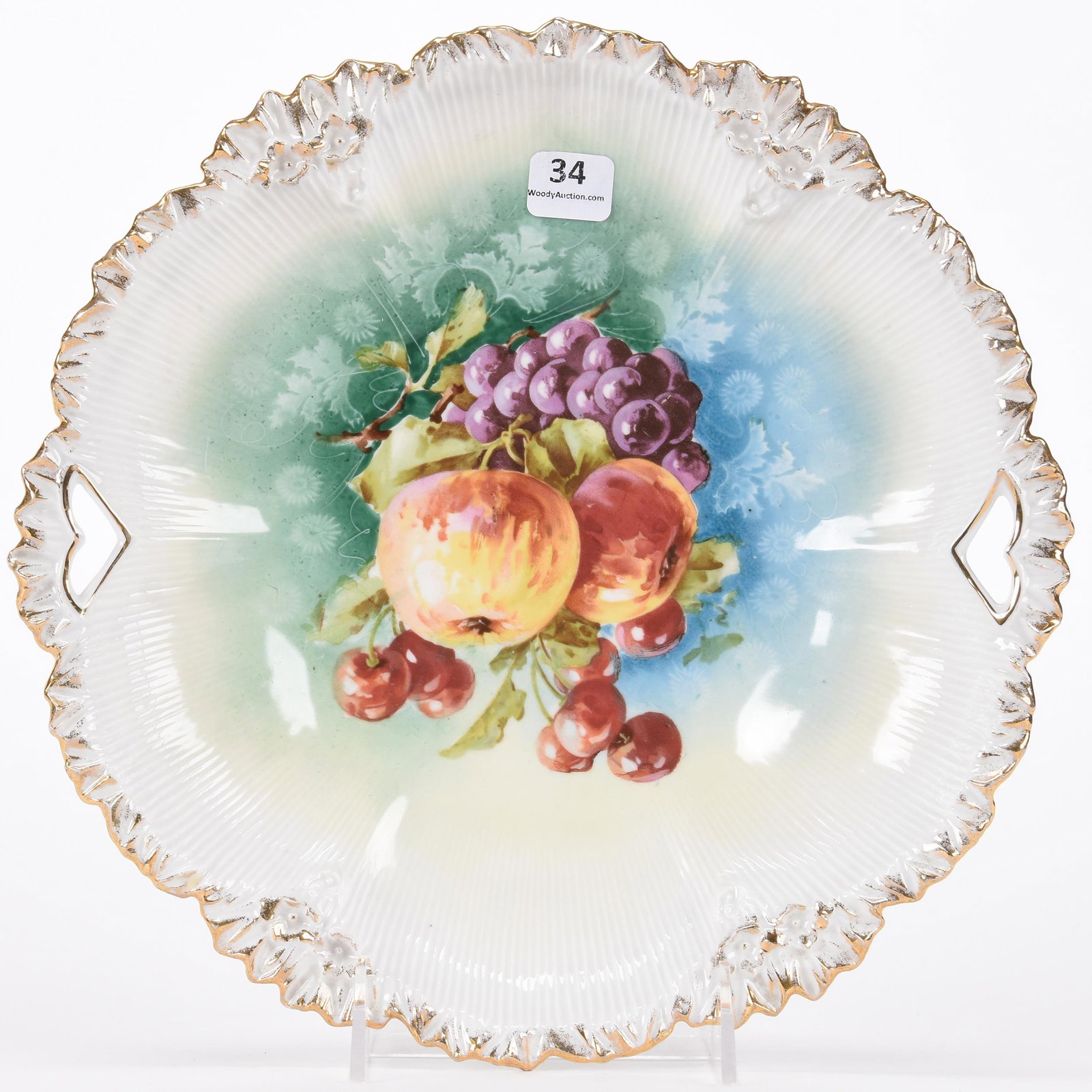 Cake plate marked R.S. Prussia: Cake plate marked R.S. Prussia; 10.75" Green, blue and white tones, fruit decor, faint hairline on rim of back of plate; Hopper Collection, Kansas