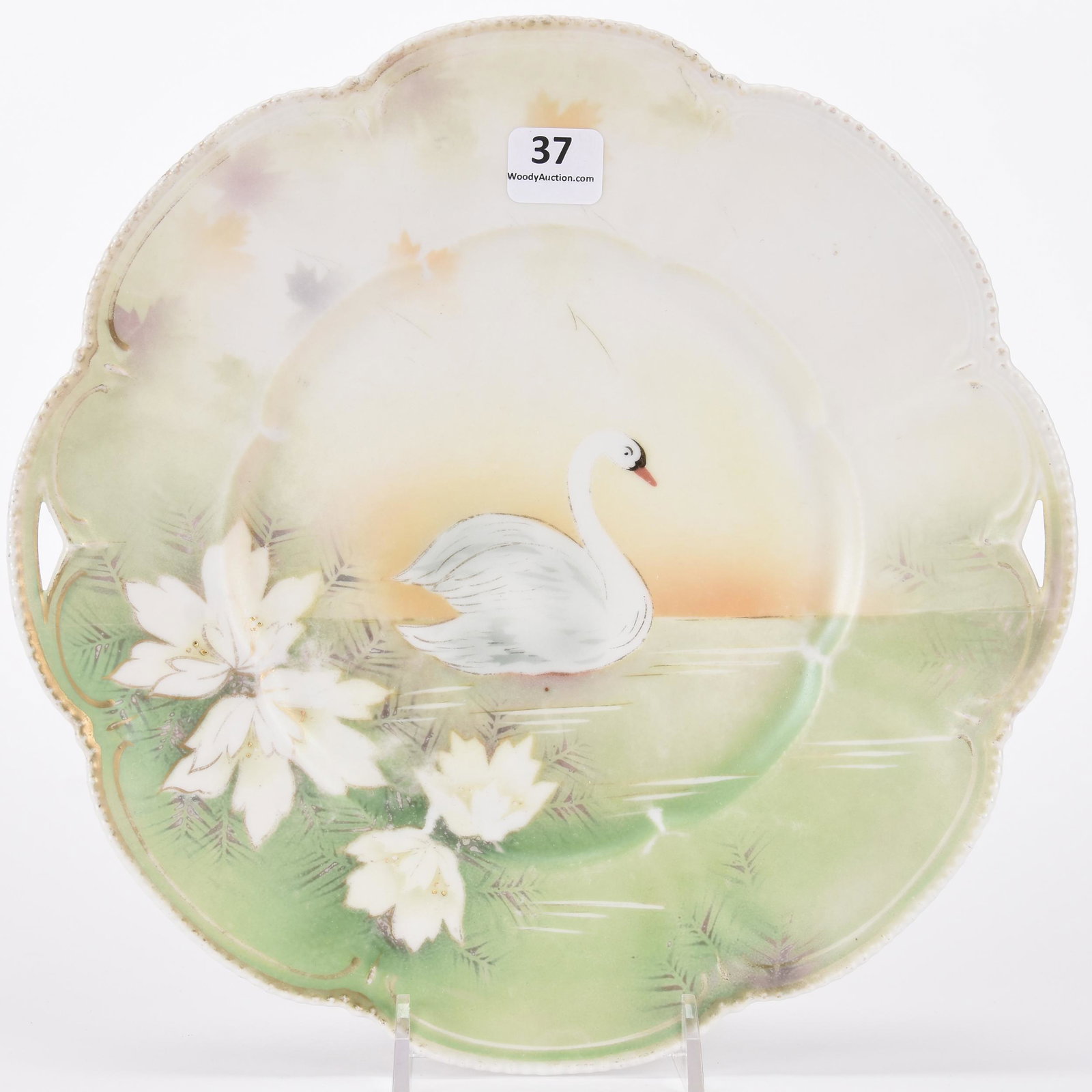 Cake plate marked R.S. Prussia: Cake plate marked R.S. Prussia; 9.75" Green and white satin finish, stylized swan decor, some fading; Hopper Collection, Kansas