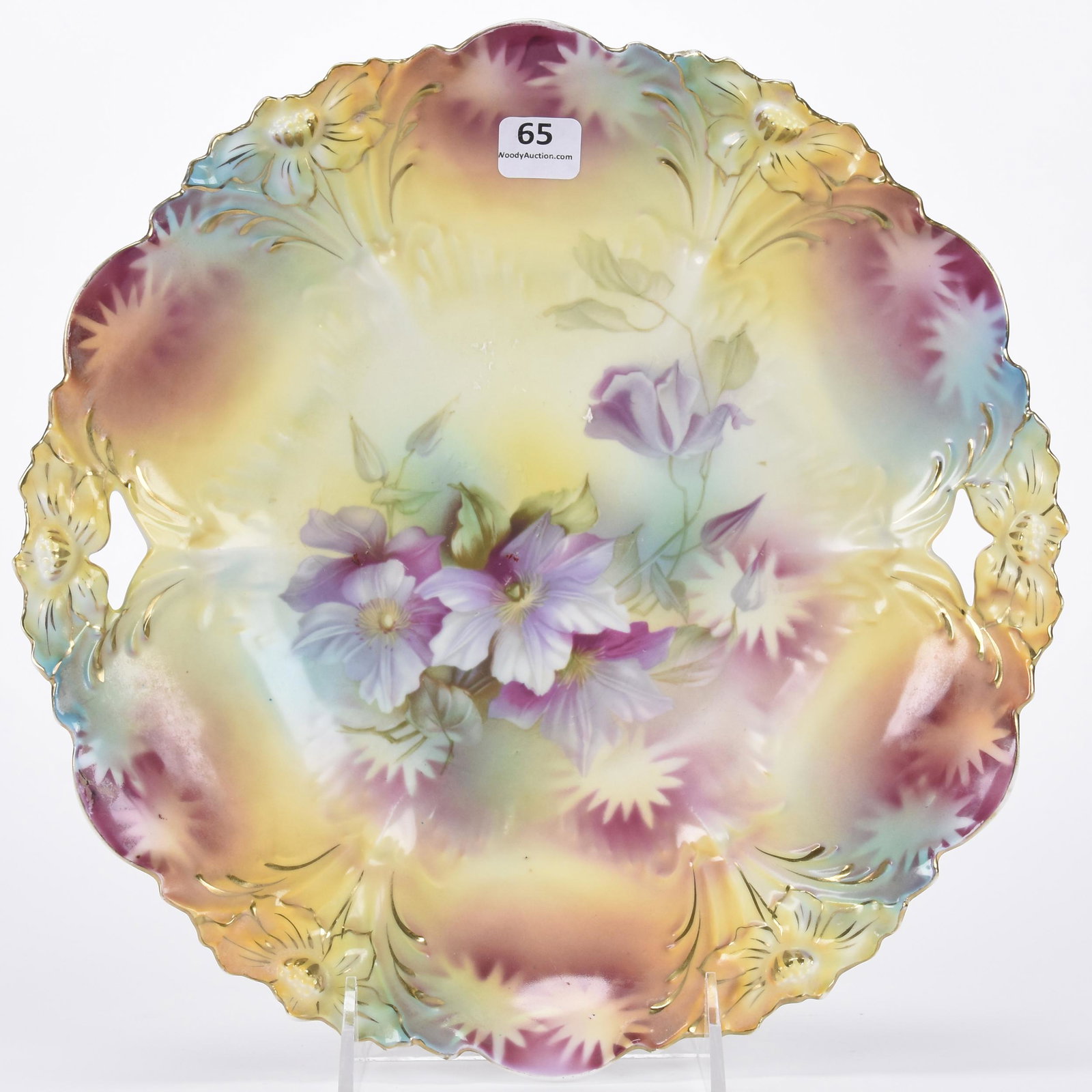Cake plate, unmarked Prussia: Cake plate, unmarked Prussia; 11" Lily mold, yellow, lavender and green tones with violet decor ; Hopper Collection, Kansas