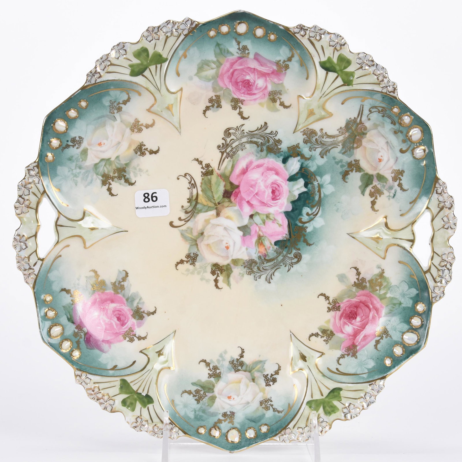 Cake plate marked R.S. Prussia: Cake plate marked R.S. Prussia; 11" Point and clover mold, cream and green tones with pink and white rose decor, gold stencil highlights, opal jewel border; Hopper Collection, Kansas