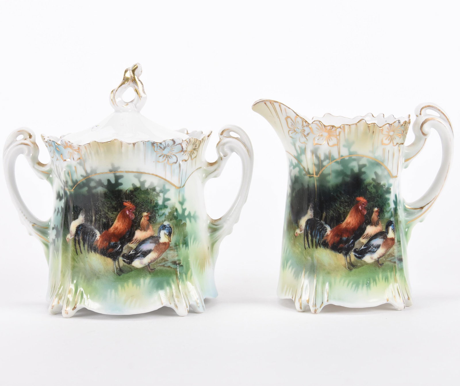 Creamer & sugar set marked R.S. Prussia: Creamer & sugar set marked R.S. Prussia; Icicle mold, barnyard scenic decor, wrong undecorated lid on sugar bowl; Hopper Collection, Kansas