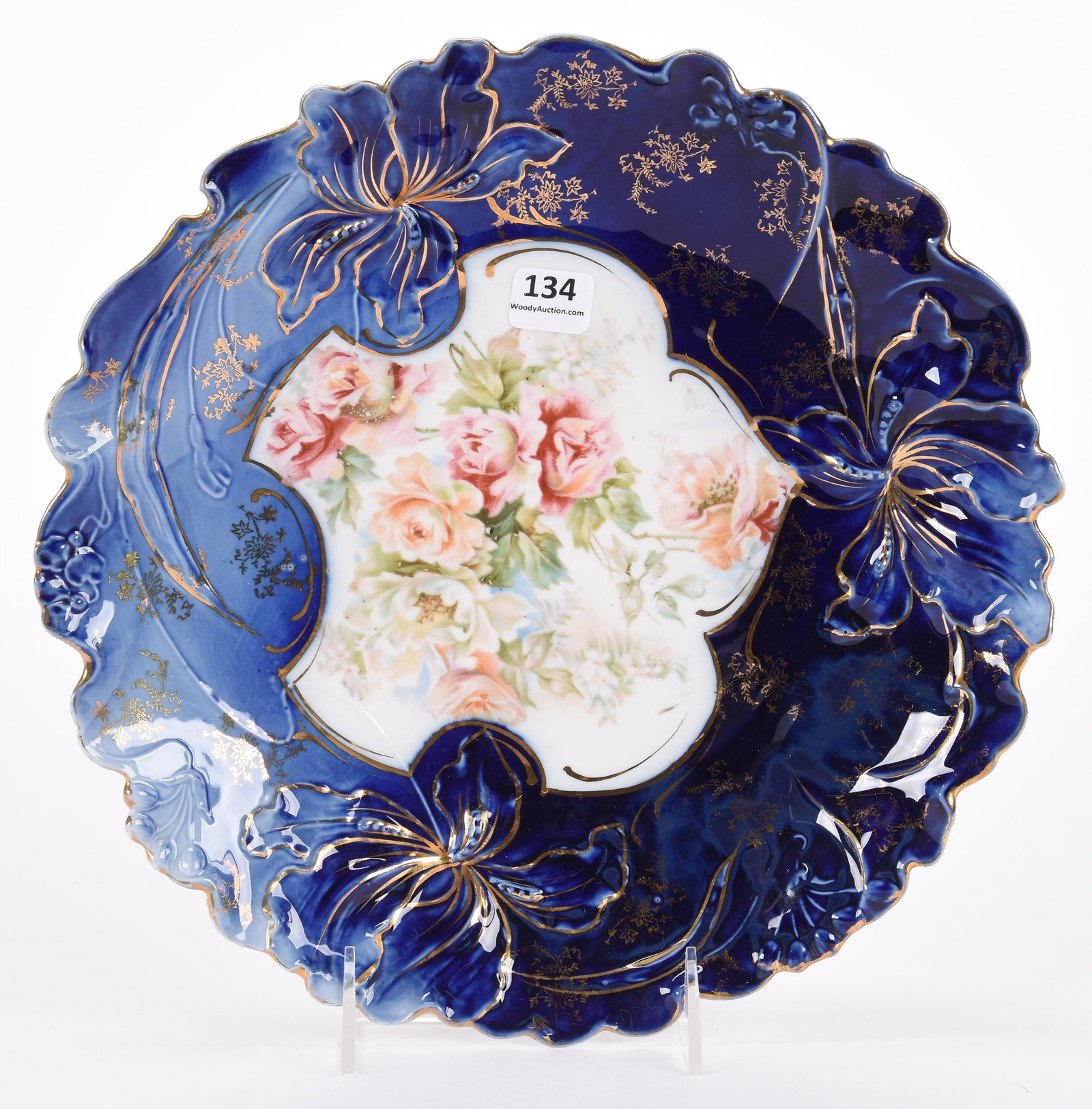 Plate, unmarked Prussia: Plate, unmarked Prussia; 11" Iris variation mold, white center with floral decor, beautiful cobalt blue border with gold stencil highlights ; Hopper Collection, Kansas