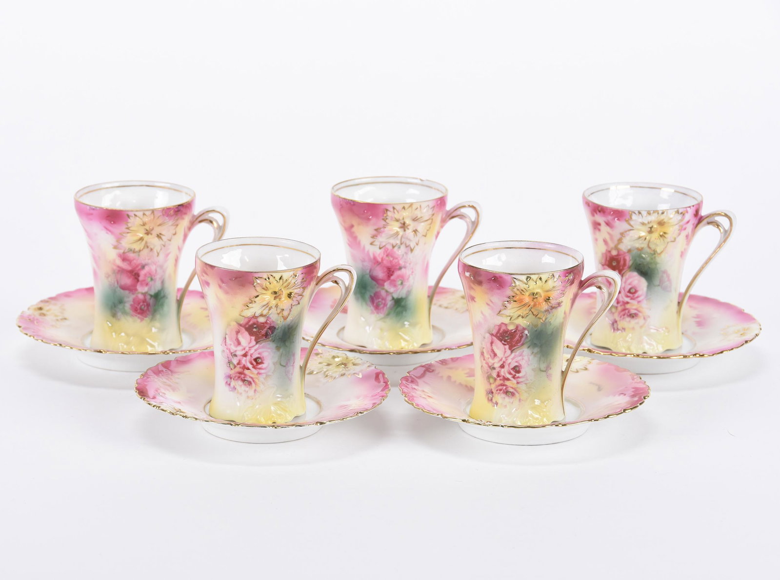 (5) Chocolate Cups and saucers marked R.S. Prussia: (5) Chocolate Cups and saucers marked R.S. Prussia; Carnation mold, pink and yellow tones with poppy decor, small rim chip on one cup; Hopper Collection, Kansas