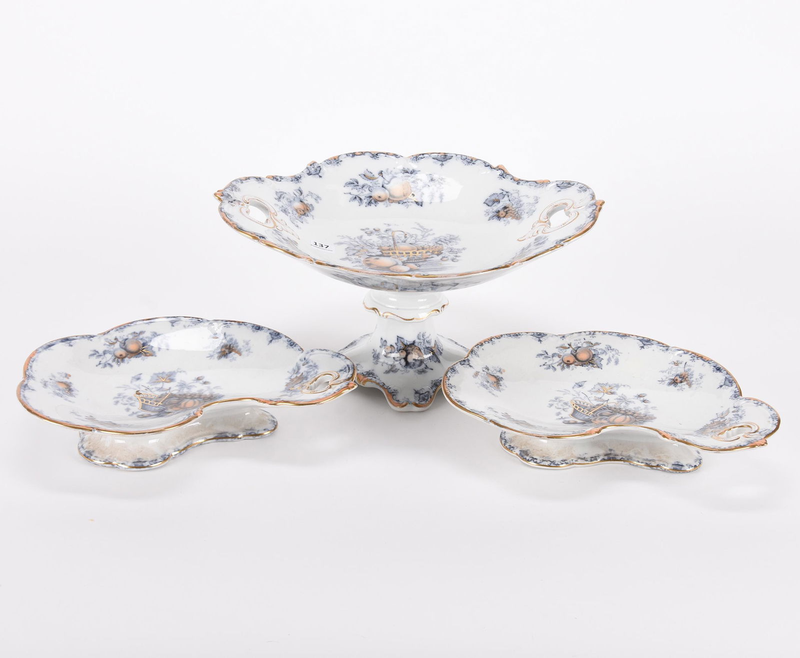 (3) Flow blue items: (3) Flow blue items; 6.5"x 13.25", 11" (1) 6.5" x 13.25" Compote; (2) 11" Oval pedestal dishes - Fruit basket flow blue pattern by Charles Meigh, circa 1840's, polychromatic highlights ; Hopper Collec