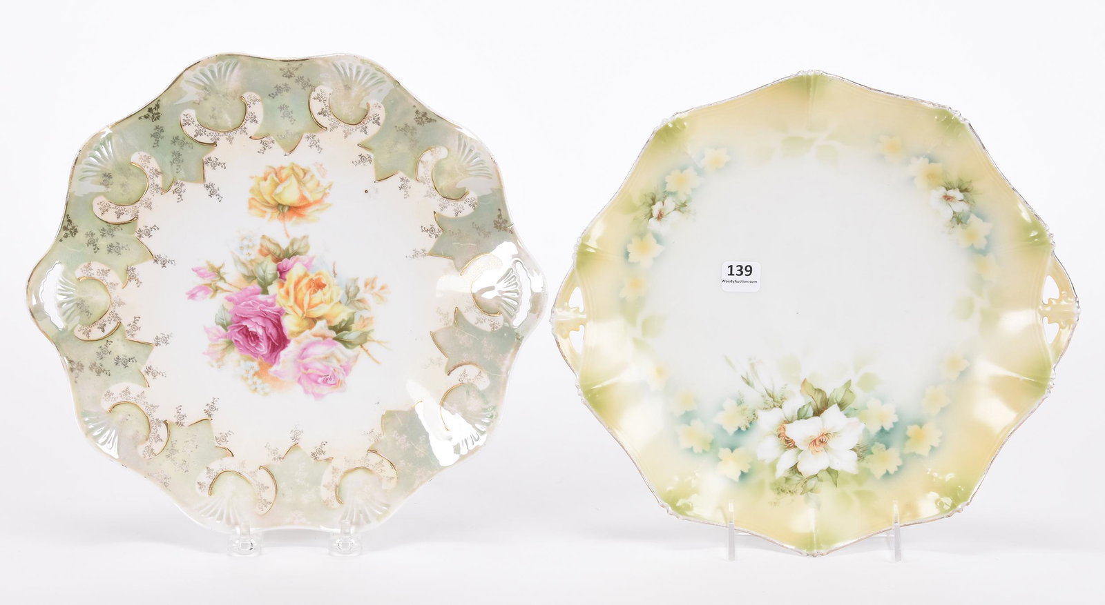 (2) Cake plates marked R.S. Prussia: (2) Cake plates marked R.S. Prussia; 11.75", 11.5" (1) 11.75", white, yellow and green tones with white floral blossom decor; (1) 11.5", white and green lustre finish with rose decor ; Hopper Collecti