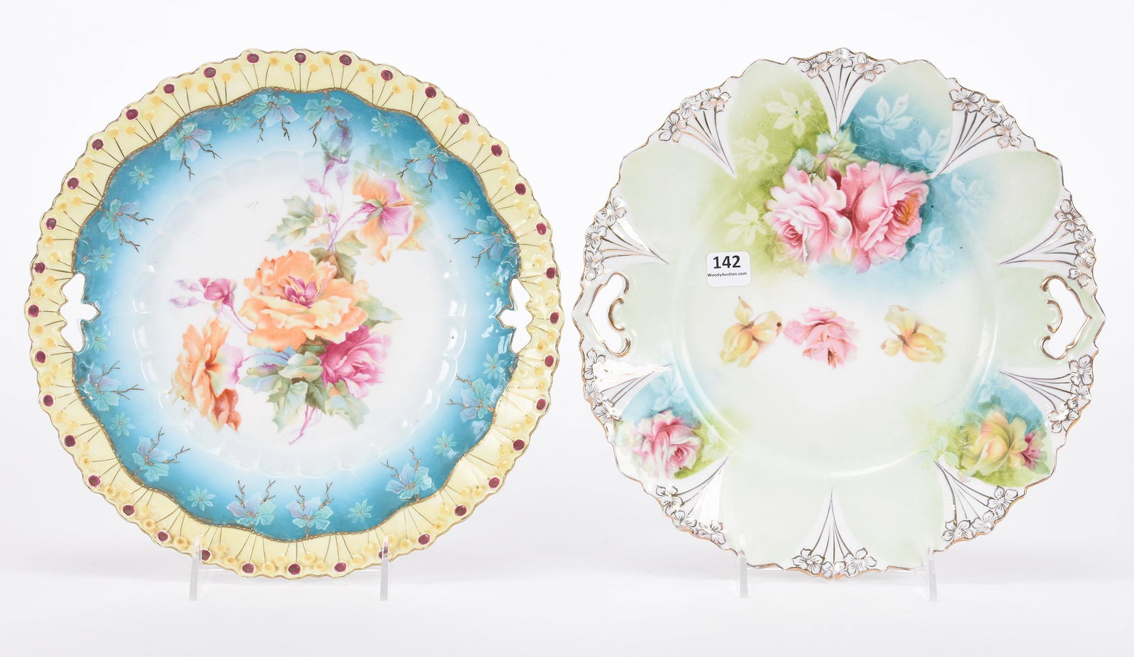 (2) Cake plates, unmarked Prussia: (2) Cake plates, unmarked Prussia; 10.5" (1) Lollipop mold, blue, white and yellow tones, floral decor; (1) Green, blue and white tones, pink and yellow rose decor ; Hopper Collection, Kansas