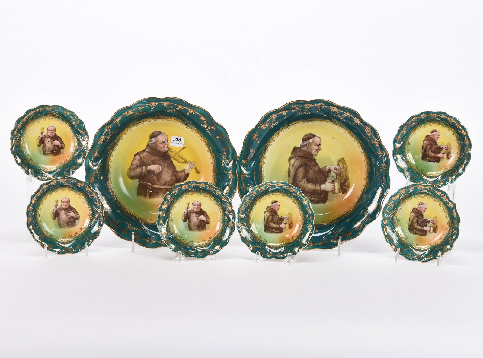 (2) Berry sets marked O.S. St. Killian (Prussia): (2) Berry sets marked O.S. St. Killian (Prussia); 10", 5" ; (2) 10" master bowls with (6) 5" matching berry bowls - all feature green borders with monk decor ; Hopper Collection, Kansas