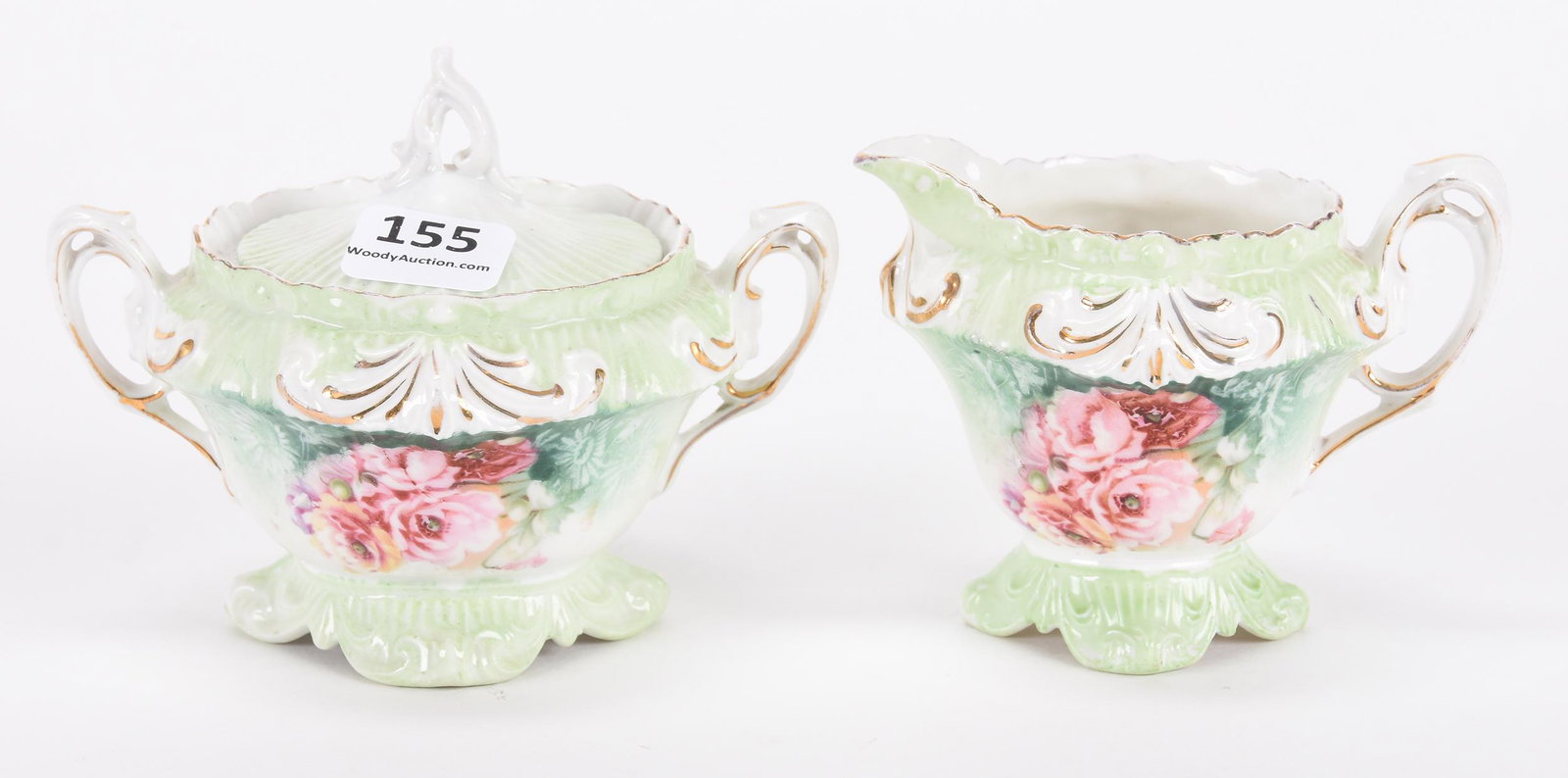Small size creamer & sugar set marked R.S. Prussia: Small size creamer & sugar set marked R.S. Prussia; Fleur de lys mold, green and white tones with pink poppy decor; Hopper Collection, Kansas