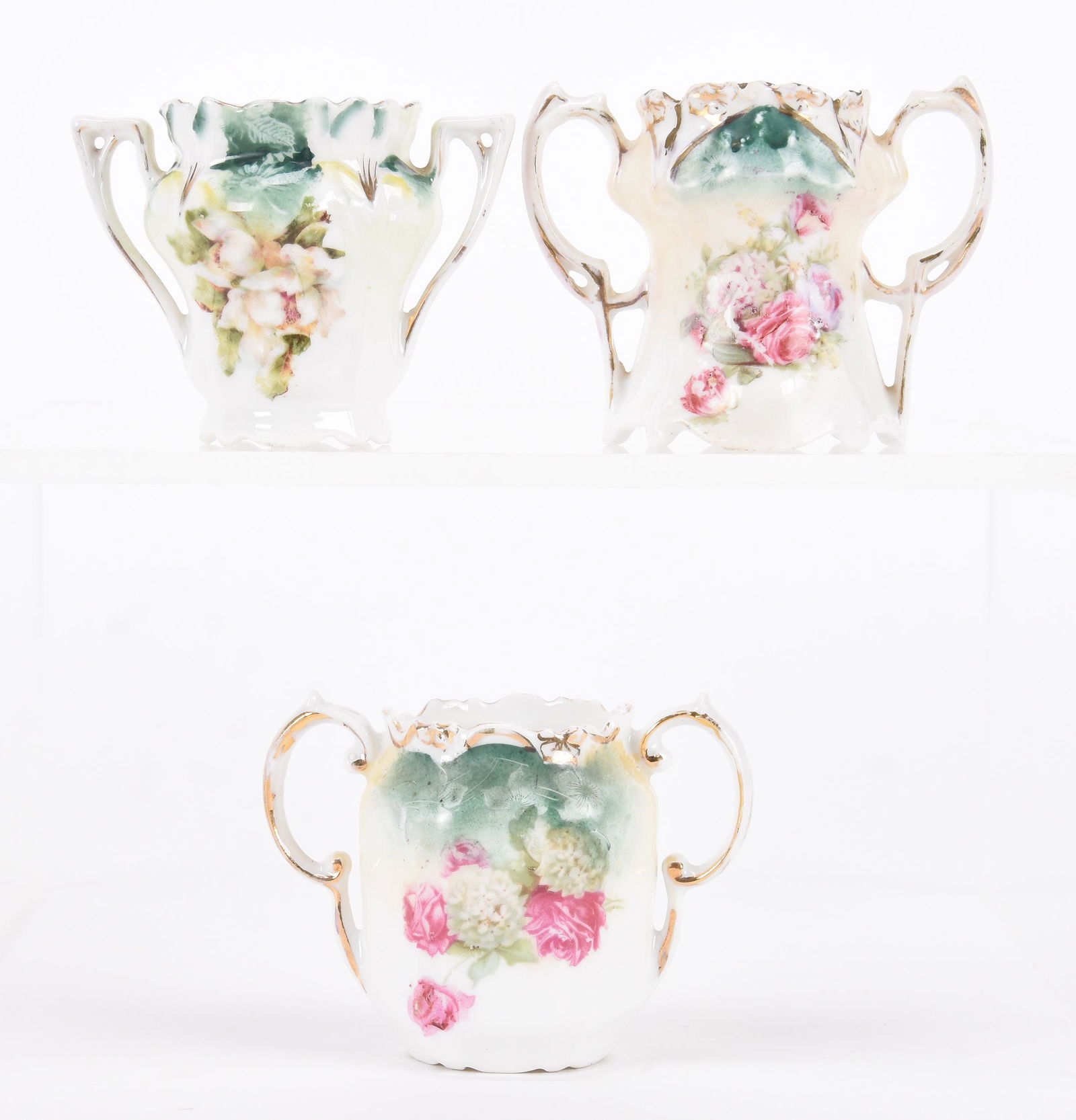 (3) Two-handled toothpick holders marked R.S. Prussia: (3) Two-handled toothpick holders marked R.S. Prussia; 2.25" (1) Iris mold; (1) Point and clover mold; (1) Six-sided; Hopper Collection, Kansas