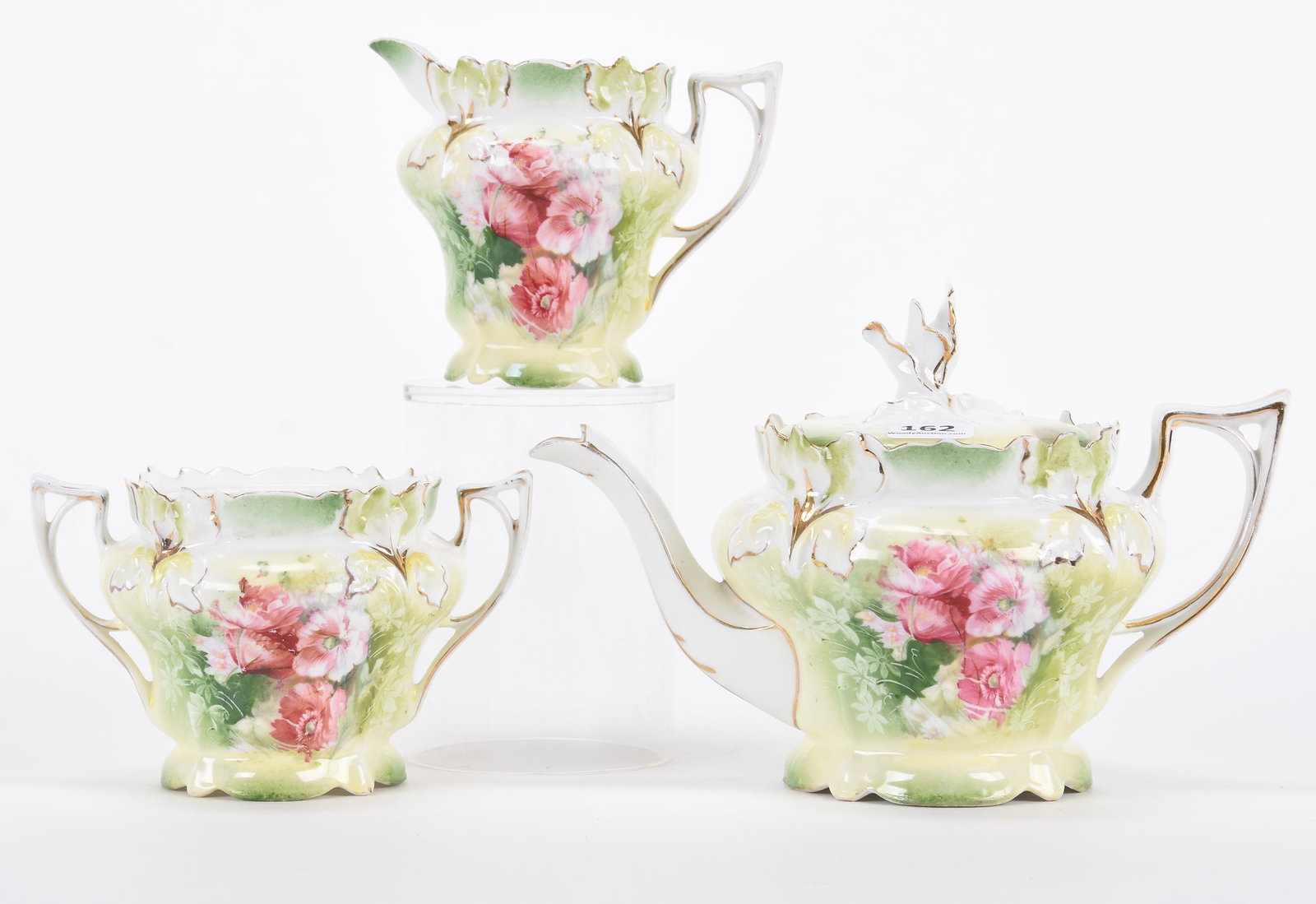 Three piece tea set marked R.S.Prussia: Three-piece tea set marked R.S.Prussia; 5.5" Iris mold with pink poppy decor, no lid on sugar bowl; Hopper Collection, Kansas