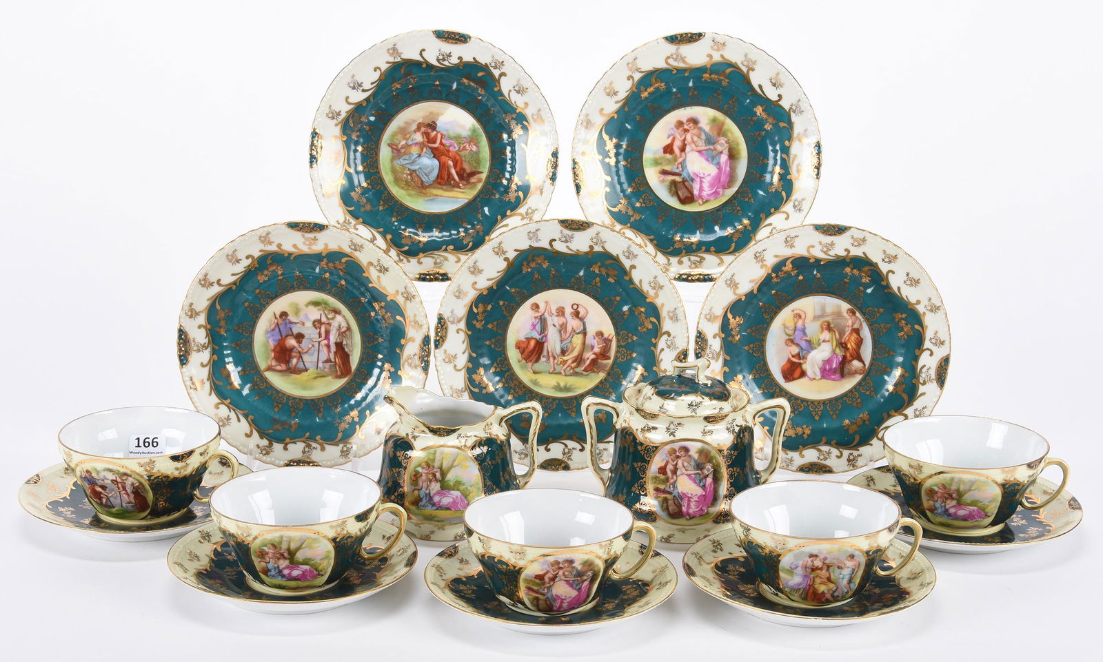 (12) Table Items marked Victoria Austria: (12) Table Items marked Victoria Austria; Cream and green tones with classic scenic decor, heavy gold highlights - creamer & sugar set; (5) cups and saucers; (5) 6.5" dessert plates; Hopper Collection