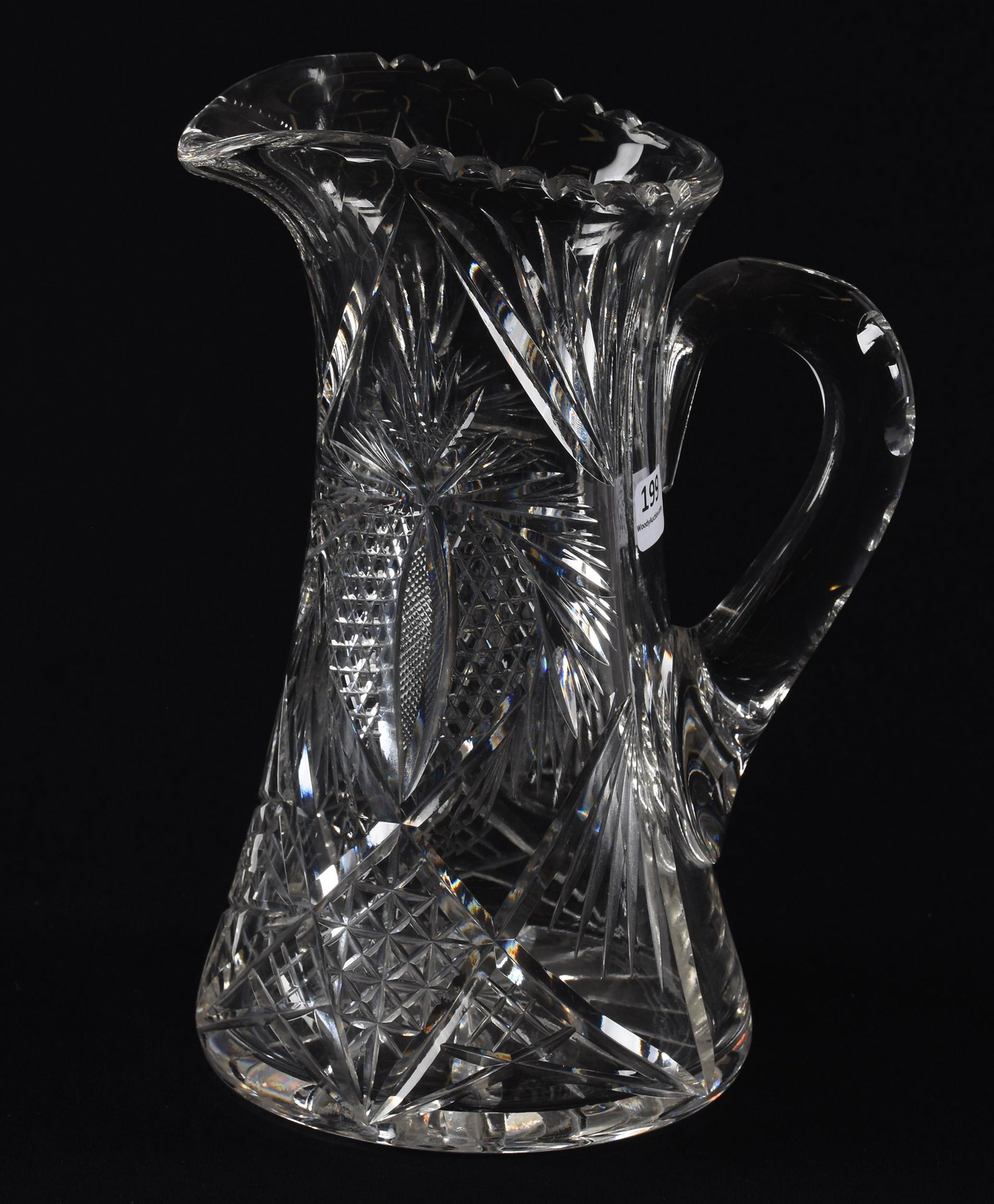 Water pitcher, American brilliant cut glass: Water pitcher, American brilliant cut glass; 9.75" Modified heart with vesica, strawberry diamond and nailhead diamond highlights, double notched handle, ray cut base; Hopper Collection, Kansas