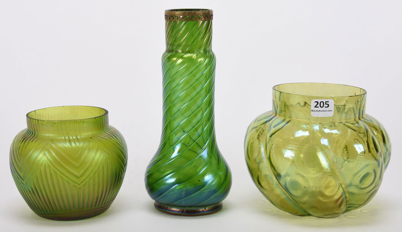 (3) Loetz style art glass vases: (3) Loetz style art glass vases; 8.25", 5.25", 4.25" (1) 8.25" swirl design; (1) 5.25" bullseye and swirl design; (1) 4.25" geometric design, some light edge nicks; Hopper Collection, Kansas