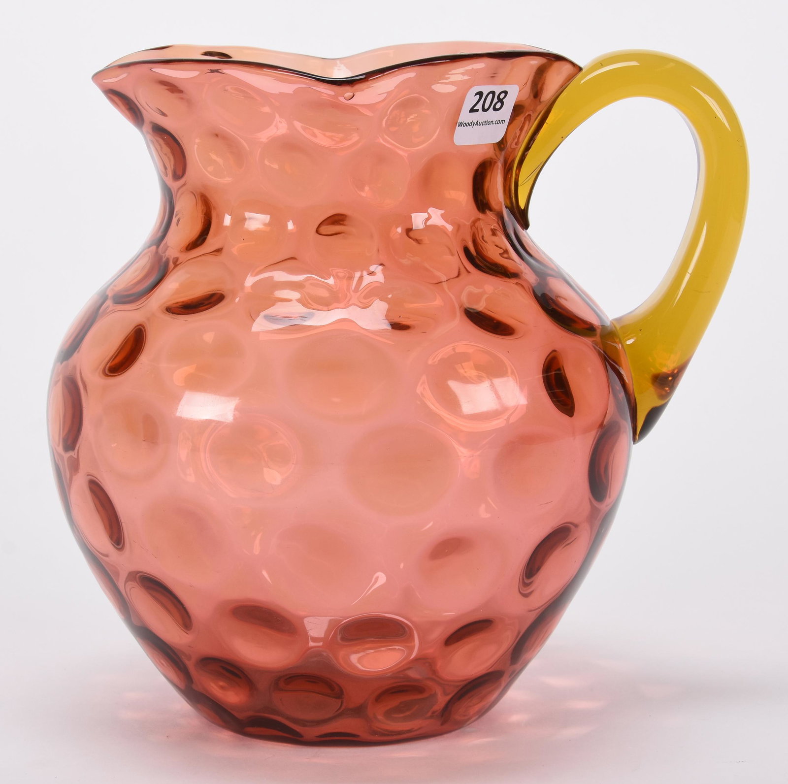 Water pitcher, cranberry art glass coinspot: Water pitcher, cranberry art glass coinspot; 7.5" Applied solid amber handle, polished pontil; Hopper Collection, Kansas