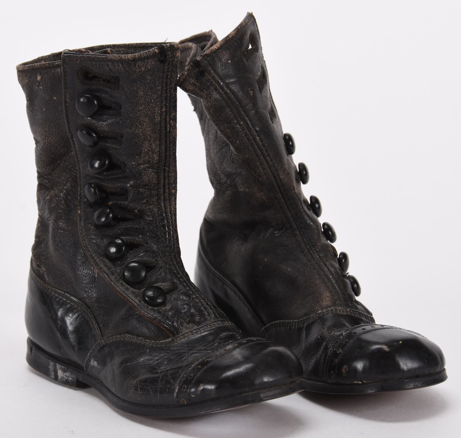 Pair vintage leather child's boots: Pair vintage leather child's boots; 5" x 5.25" Each boot has slots for (9) buttons, total of (4) buttons are missing; Hopper Collection, Kansas