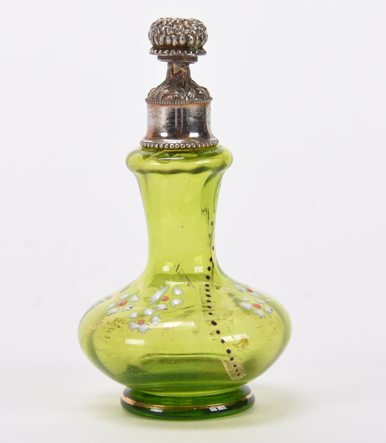 Perfume, green art glass: Perfume, green art glass; 4.5" Silverplate top, floral blossom screw cap has two holes on sides for dispensing, enamel floral decor; Hopper Collection, Kansas