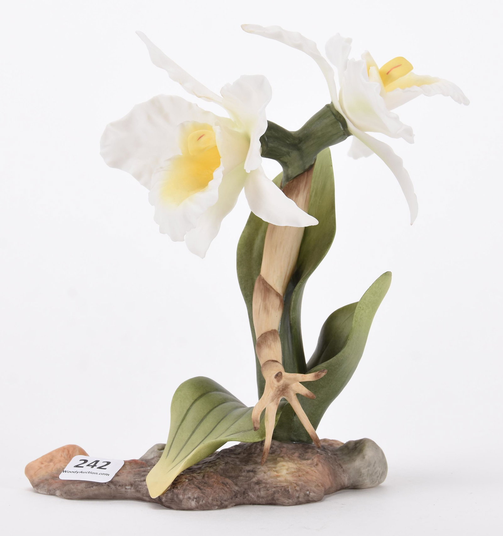 Boehm porcelain figural group: Boehm porcelain figural group; 7.5" Titled "White cattleya orchids #F507" ; Hopper Collection, Kansas