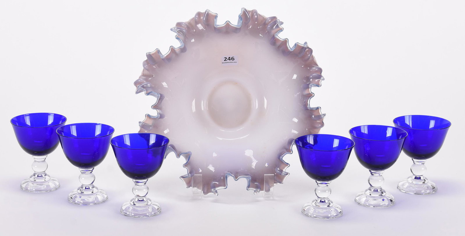 Brides bowl & (6) stems: Brides bowl & (6) stems; 10", 3.75" (1) 10" cased lavender and white ruffled brides bowl with 3.825" base diameter; (6) Stems with cobalt blue bowls, clear stem and foot; Hopper Collection, Kansas