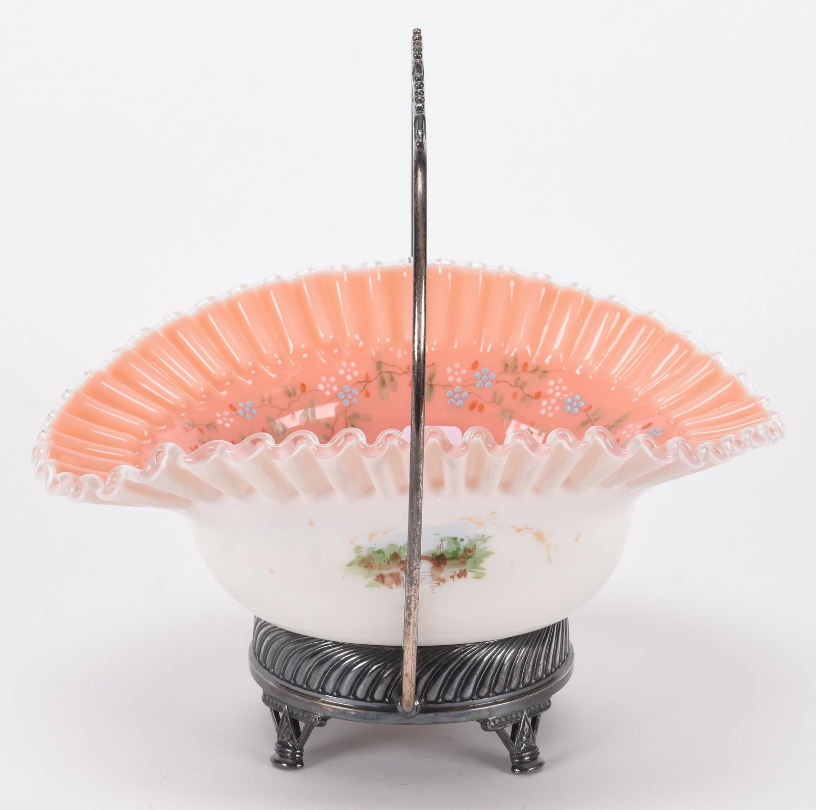 Brides basket: Brides basket; 9.5" x 10.5" Cased art glass bowl set on Aurora #0753 silverplate frame - ruffled bowl has pink interior with enamel floral highlights, white exterior with enamel floral ; Hopper Collec