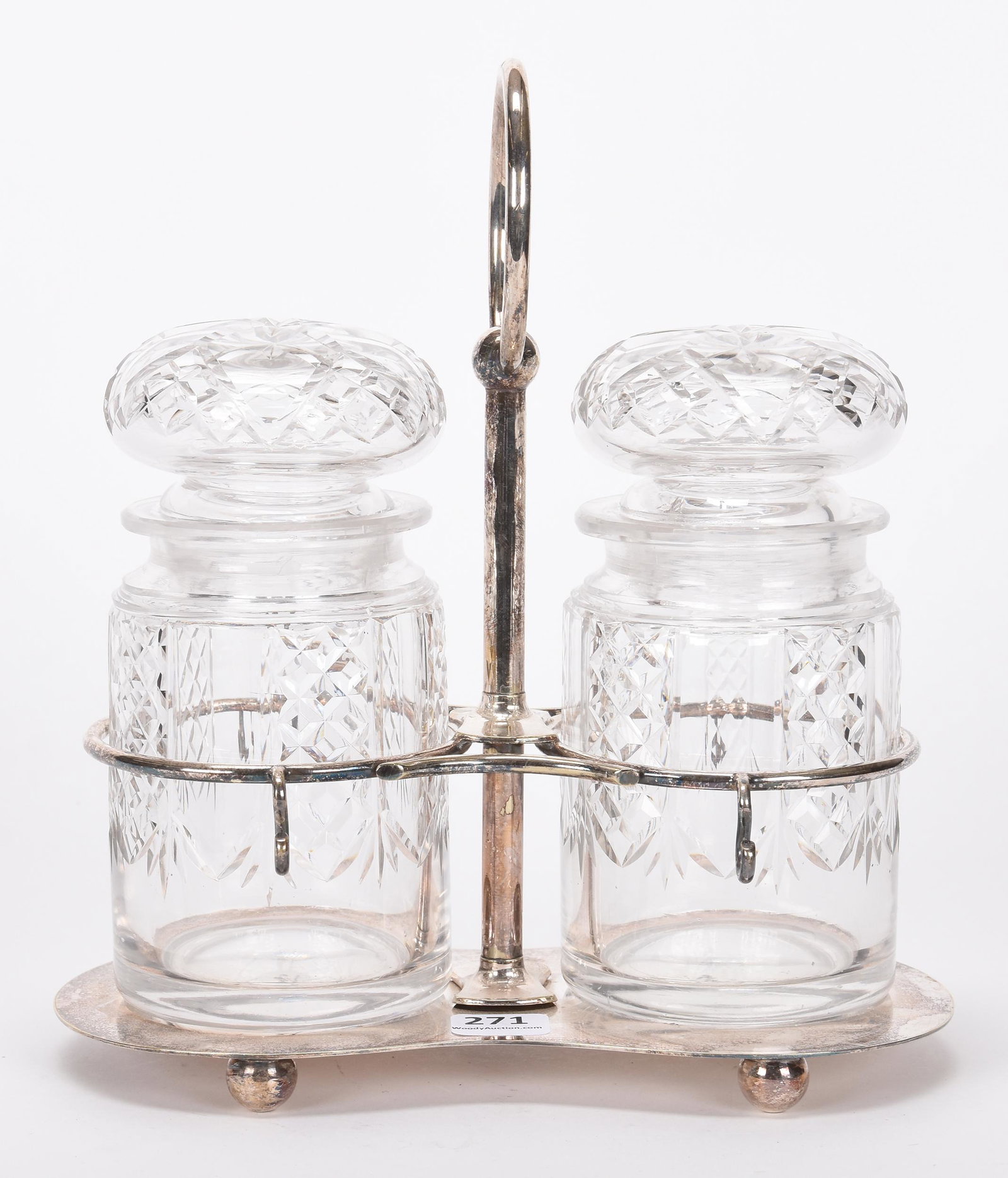 Double pickle castor: Double pickle castor; 9" x 8" Two clear cut glass inserts with glass lids, set on English silverplate frame; Hopper Collection, Kansas
