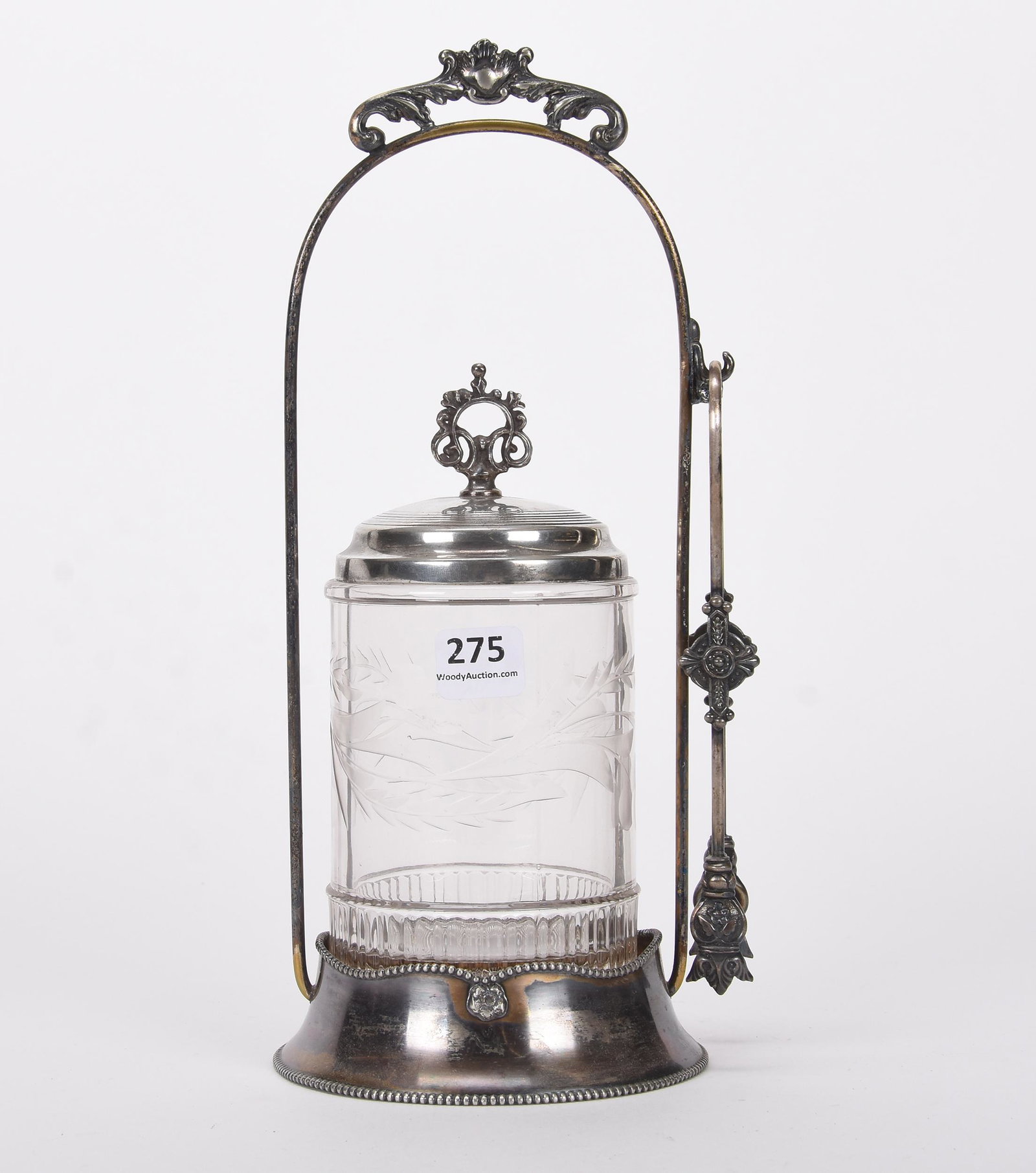 Pickle castor: Pickle castor; 10.5" Clear insert with engraved floral motif, set on Pairpoint #B601 silverplate frame; Hopper Collection, Kansas