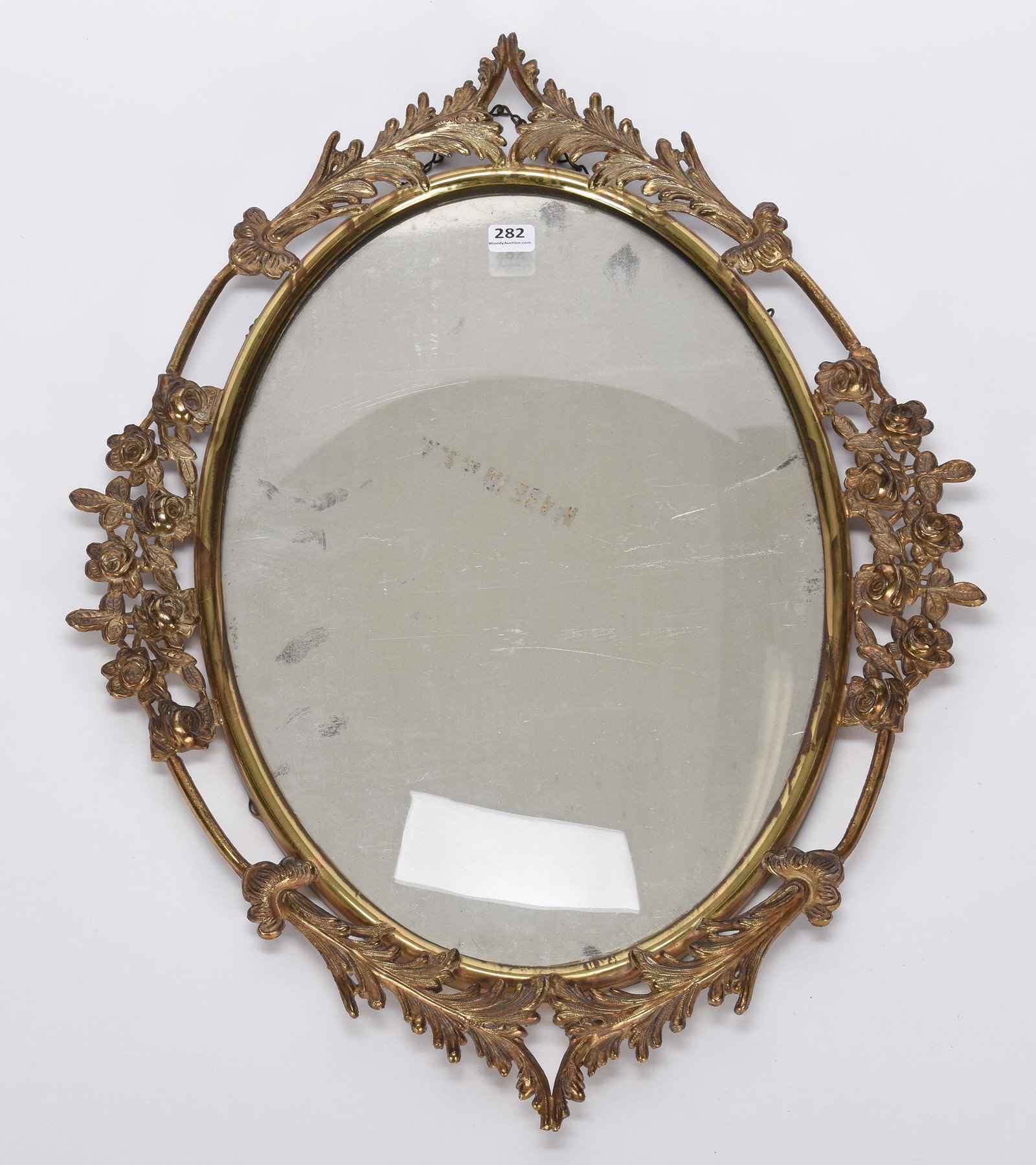 Brass oval picture frame: Brass oval picture frame; 22.5" x 16.5" with 16" x 11" picture size, floral and leaf border design on frame; Hopper Collection, Kansas